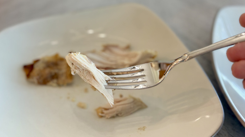 Small piece of chicken on fork
