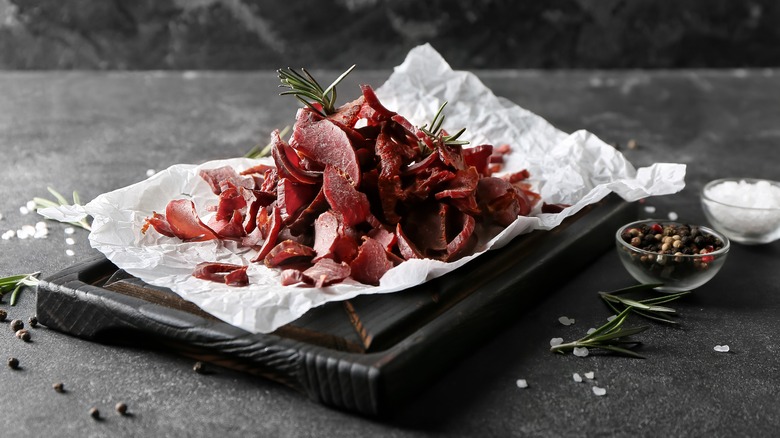Pile of beef jerky on black board