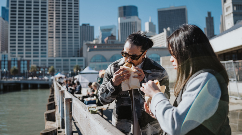 A couple eating on San Francisco's piers
