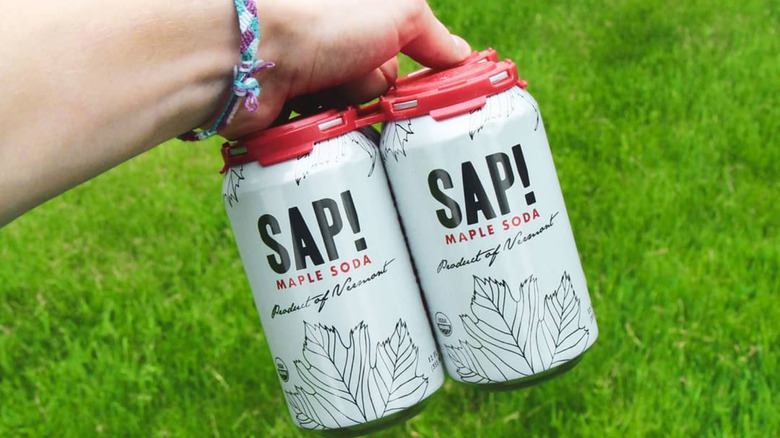 Sap! maple sodas held over grass
