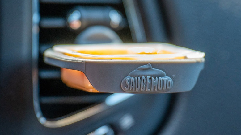 Saucemoto dip clip holder attached to car air conditioner vent