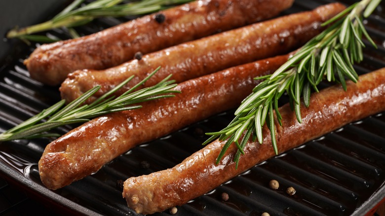 sausages and rosemary in pan