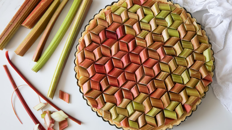 rhubarb tart beside peeled rhubarb 