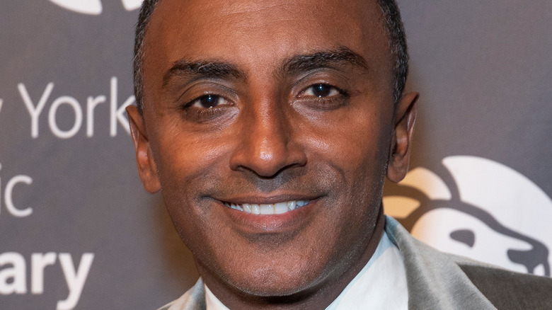 chef marcus samuelsson smiling on red carpet