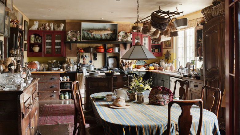 A kitchen overwhelmed with decor, plates, and other items