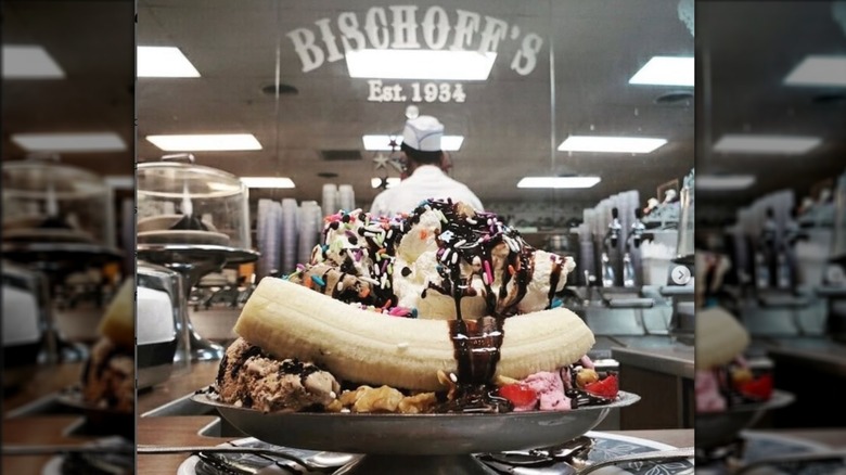 Banana split on counter at Bischoff's with logo on mirror on wall