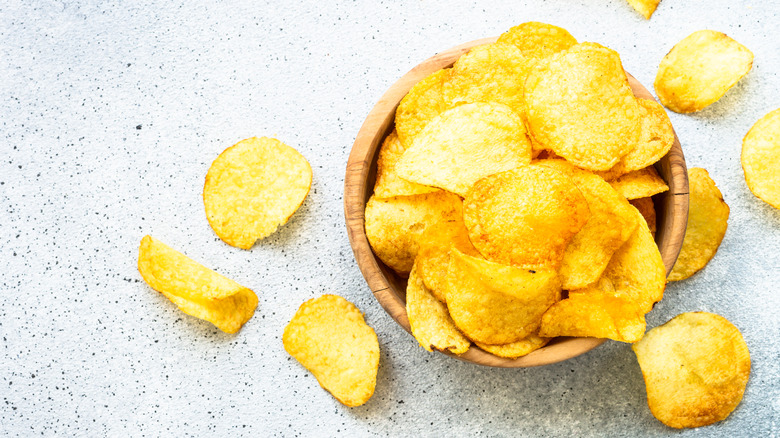 Potato chips in wooden bowl