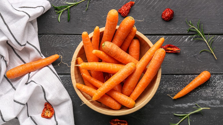 Wooden bowl of carrots