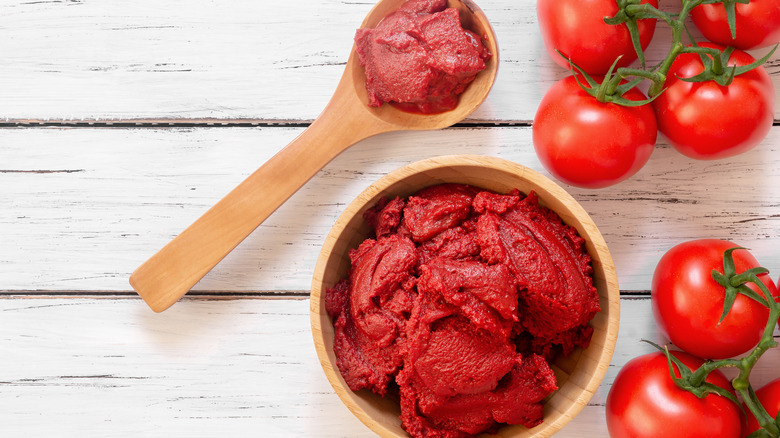 Tomato paste in wooden utensils