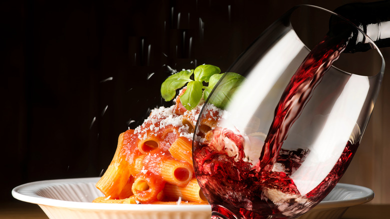 Pouring red wine in glass