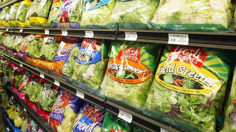 grocery shelf of bagged salad