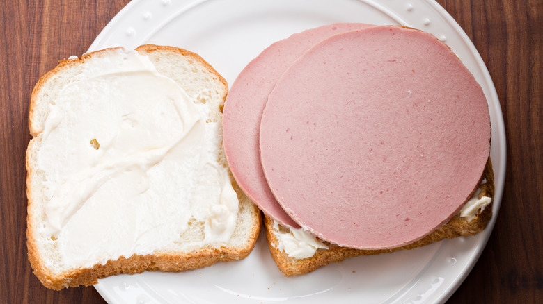 Bologna sandwich on white bread with mayonnaise