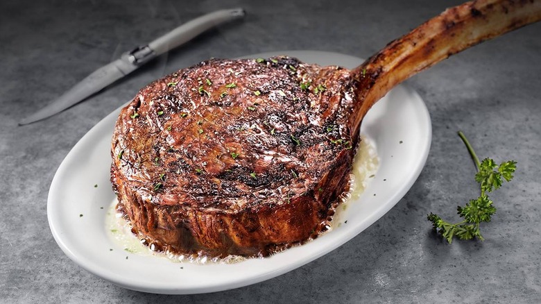 Ruth's Chris steak on buttered plate