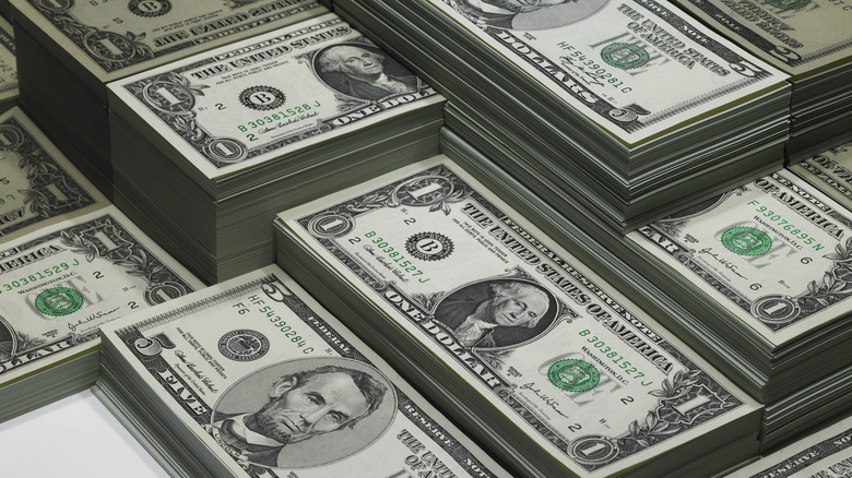 stacks of paper bills arranged in a grid