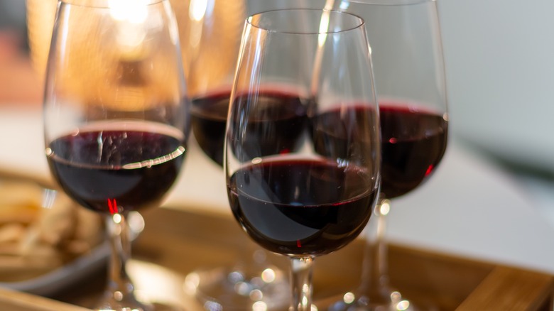 four glasses of red wine