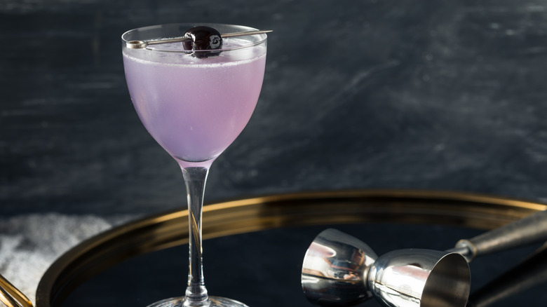 Classic Aviation cocktail on tray with bar tools