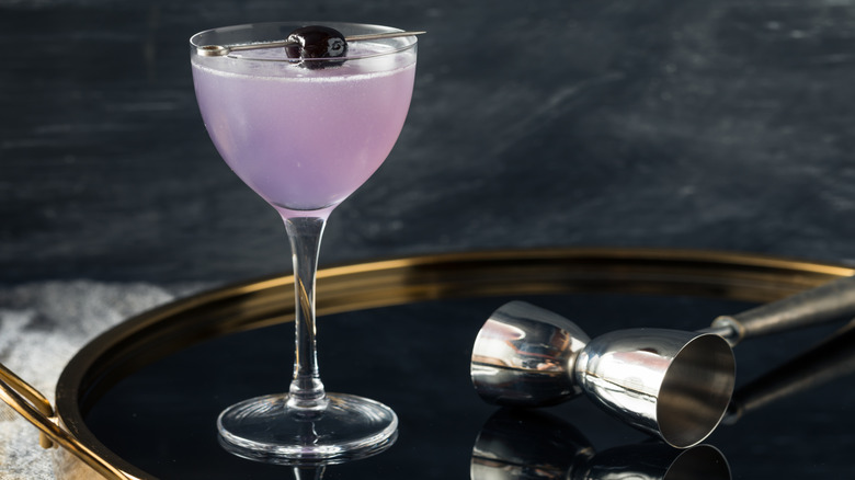 Classic Aviation cocktail on tray with bar tools