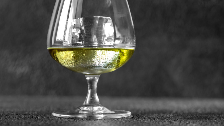 A snifter of Chartreuse on the rocks