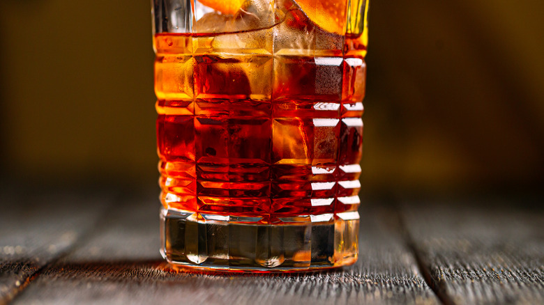 classic negroni cocktail with an orange swath