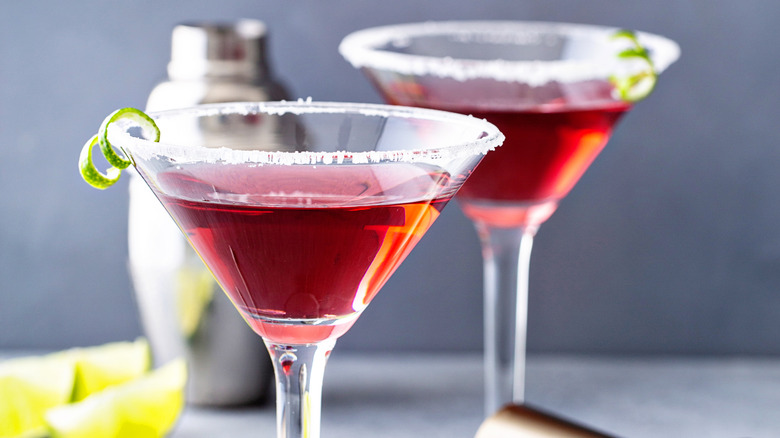 Cosmopolitan martinis with a sugar rim and lime garnish