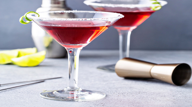Cosmopolitan martinis with a sugar rim and lime garnish