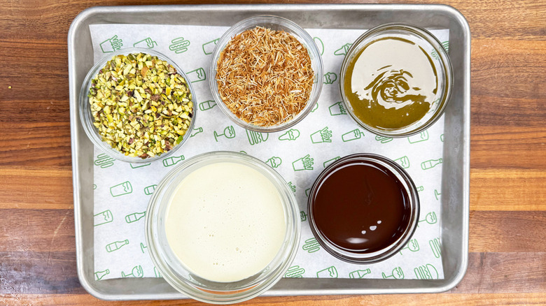 ingredients for Shake Shack Dubai Chocolate Pistachio Shake in glass bowls