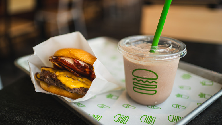 A Shake Shack burger and milkshake on a tray