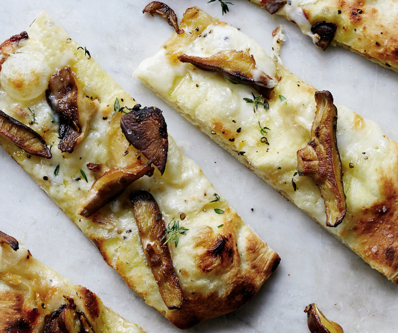 Strong Taleggio paired with bold roasted garlic and funky shiitake mushrooms: a formula for great pizza.