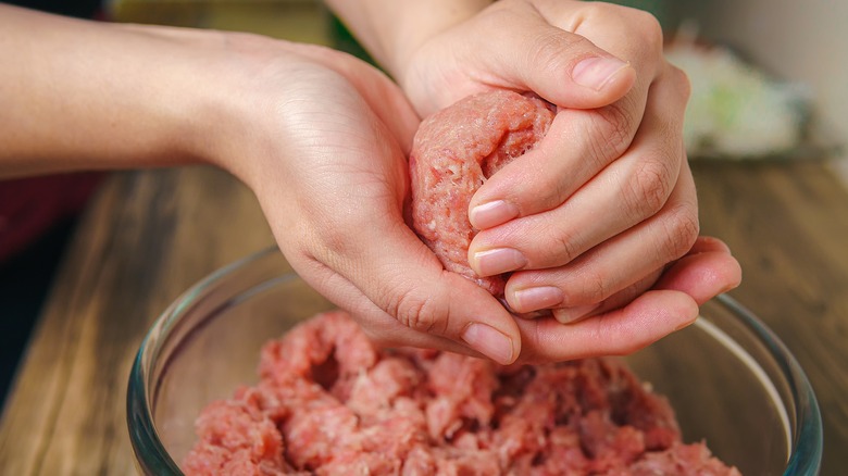 Rolling ball of ground beef