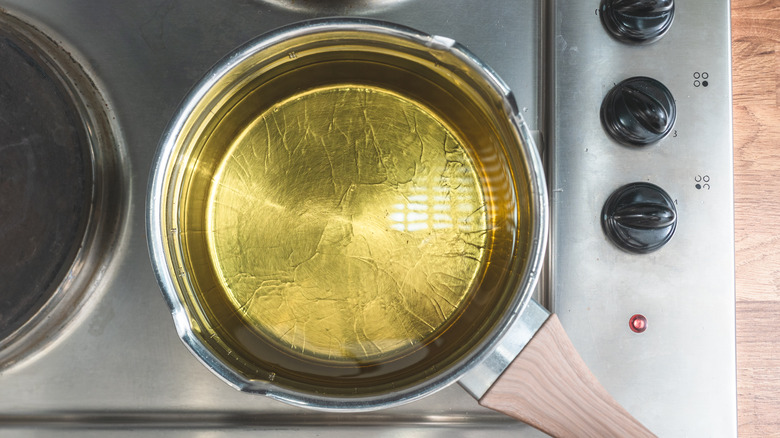 Pot of oil heating on stove