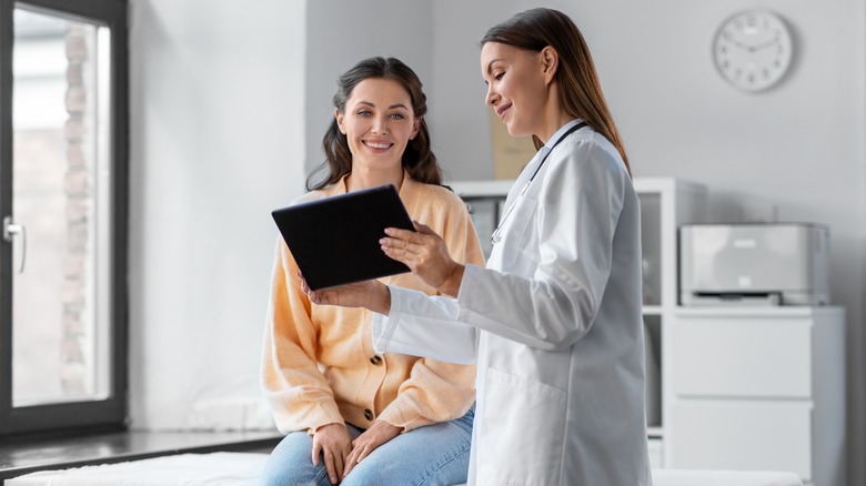 Doctor speaking to young boy