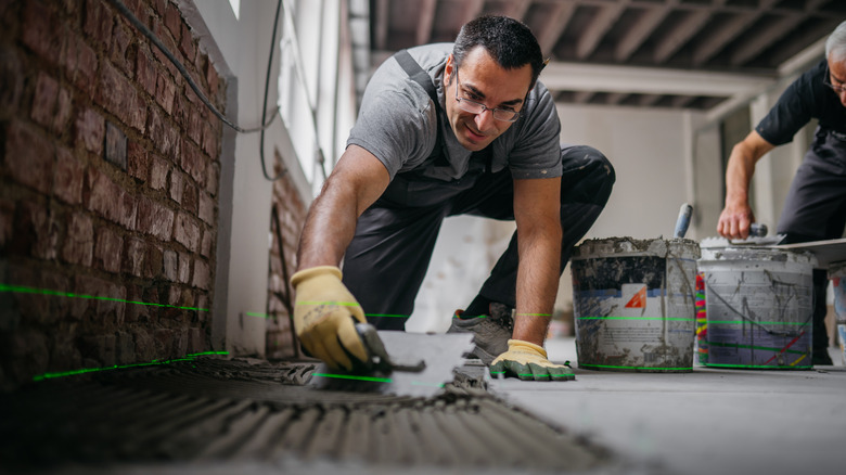 homeowner laying concrete inside