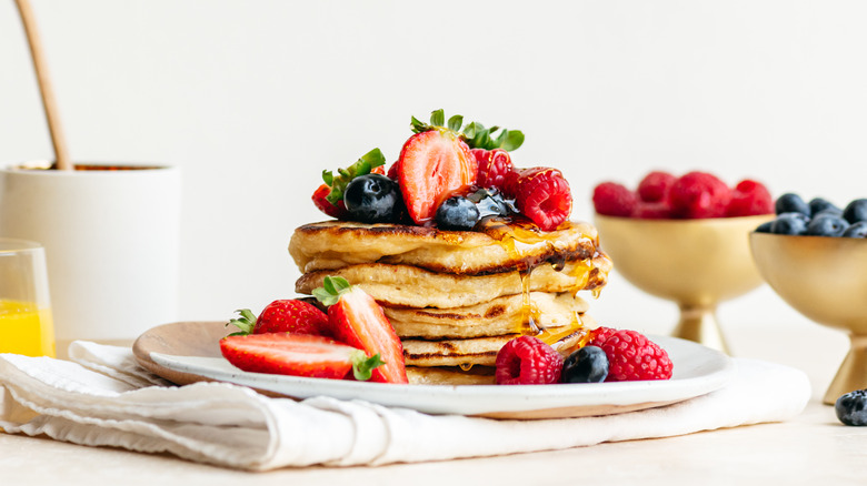 sourdough discard pancakes with berries and syrup
