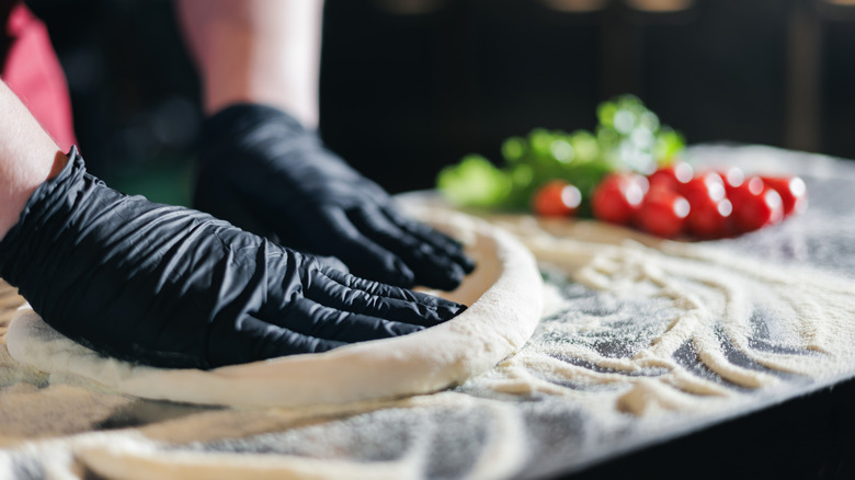 A chef needs pizza dough by hand