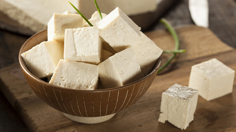 chunks of tofu in a wooden bowl