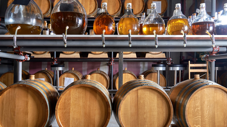 Whiskey barrels and bottles