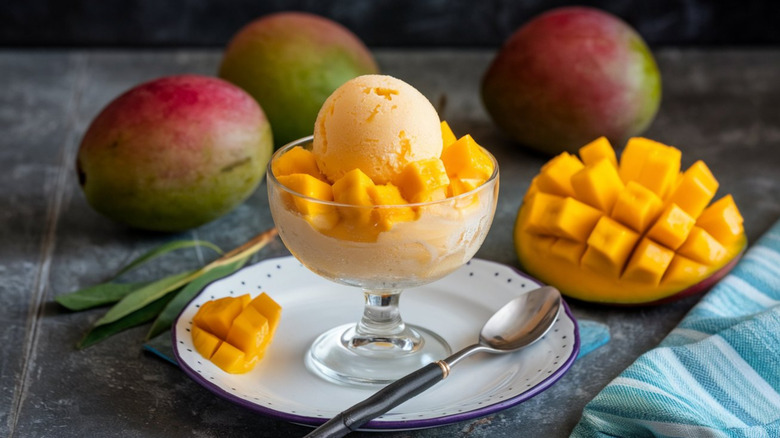 Mango sorbet with pieces of mango in a bowl