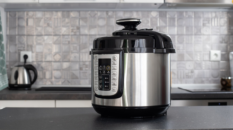 An instant pot on a kitchen counter.