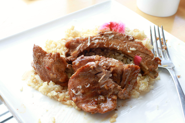 Slow-roast succulent pork shoulder with garlic, soy sauce, bay leaves and beer for dinner tonight.