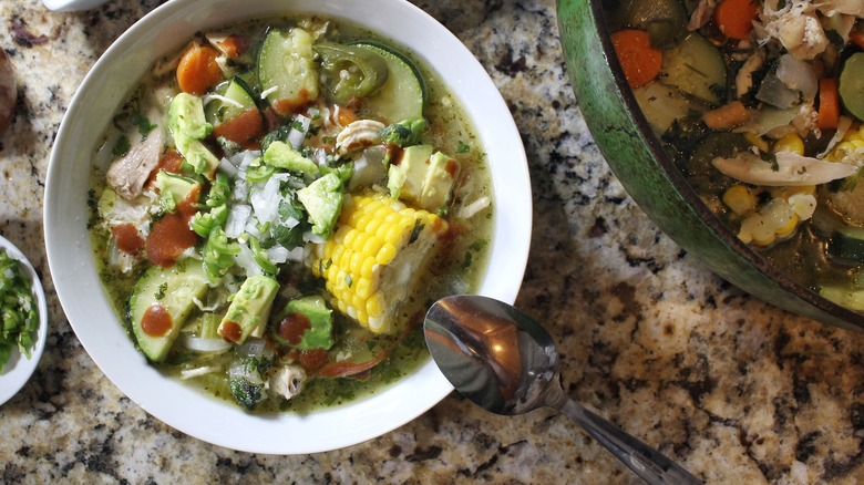 bowl of caldo de pollo with spoon