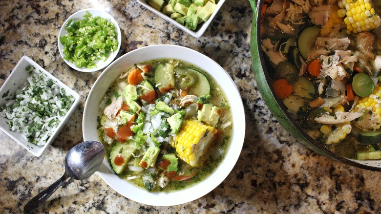 caldo de pollo with garnishes