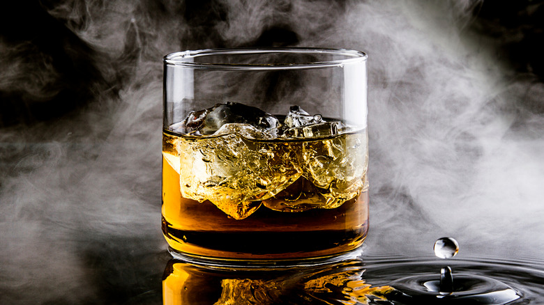 iced cocktail with smoke in background