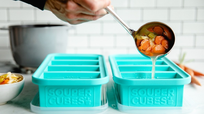 Ladling soup into Souper Cubes