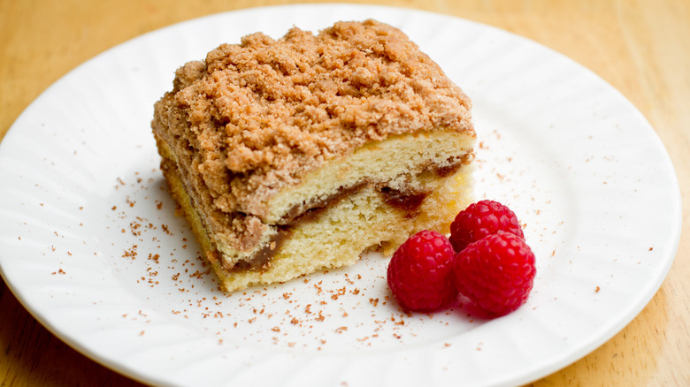 Coffee cake on plate with raspberries 