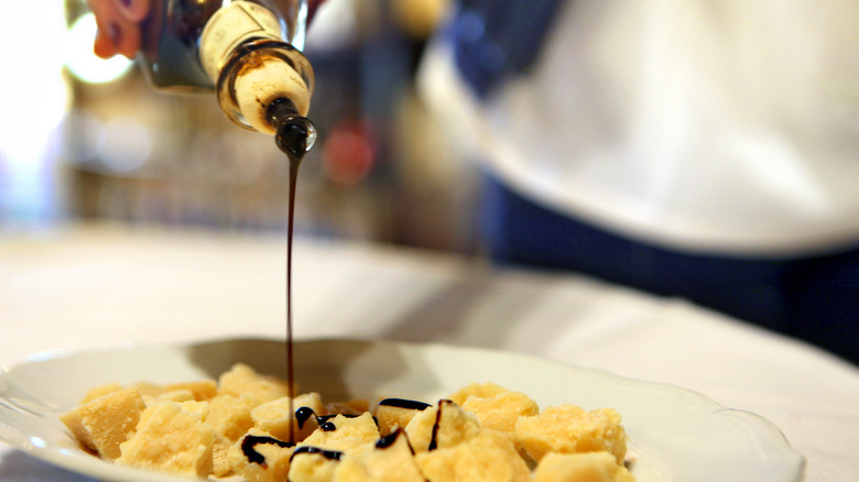 Aged balsamic drizzled over cheese