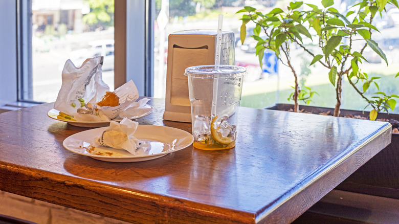 Remains of food and garbage on a restaurant table