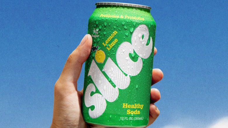 Can of Slide soda held in hand.