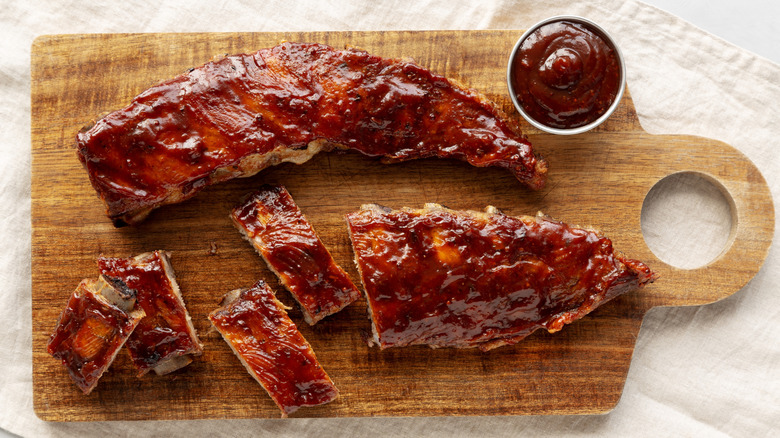 Baby Back Ribs with a side of barbecue sauce