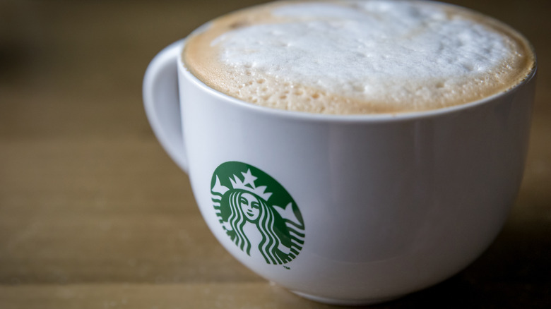 Starbucks mug with foamy drink