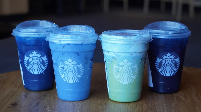 Starbucks' Blue Coconut Lemonade Refresher, Ocean Drink, Iced Blue Coconut Matcha, and Blue Coconut Refresher (left to right).
